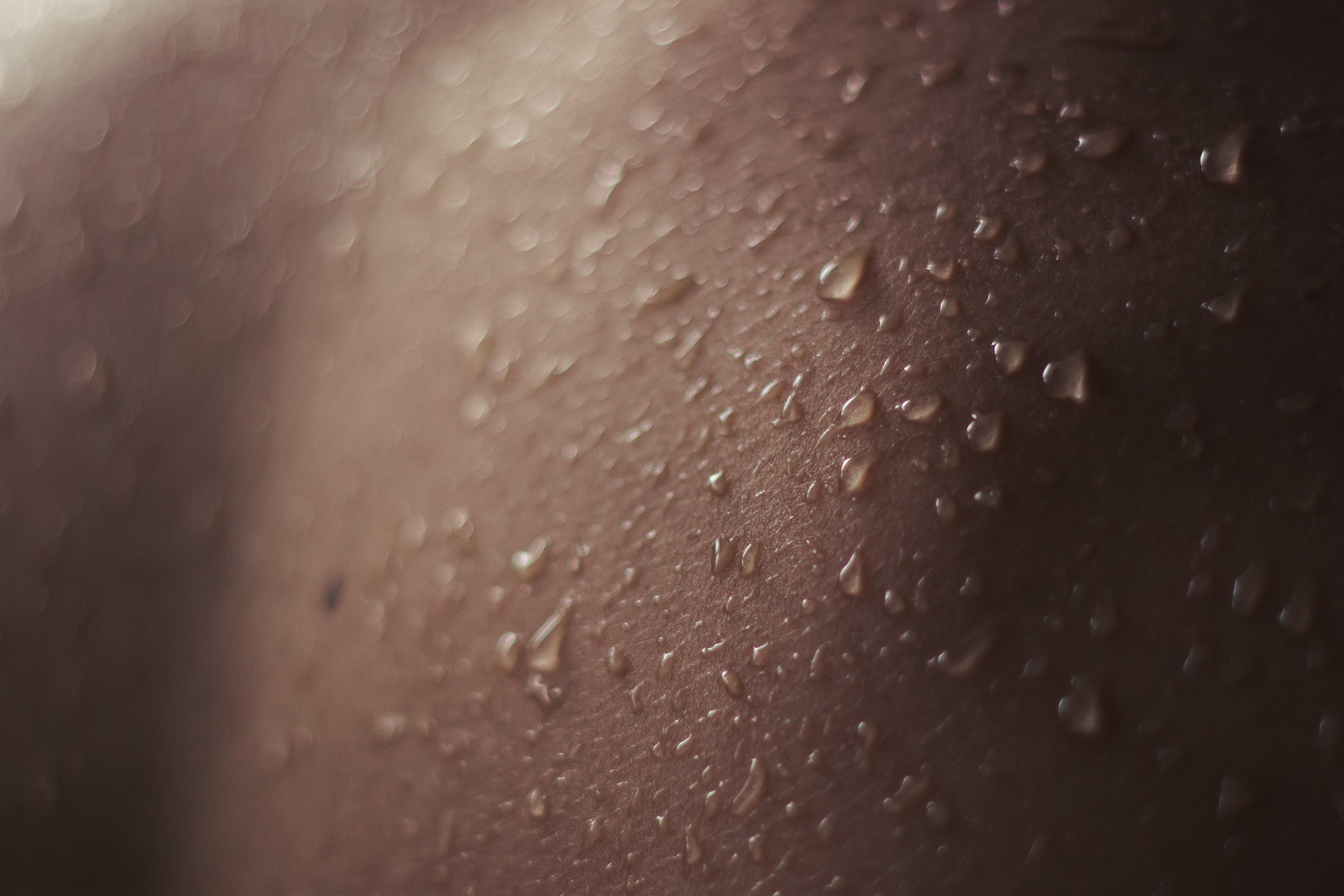 Close-up of sweat droplets on skin surface.