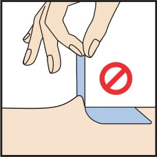 An illustration showing the incorrect way to remove a bandage, by pulling it vertically off the skin at a 90-degree angle, with a red stop sign icon.