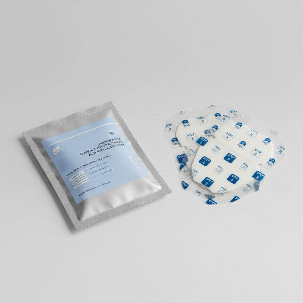 A product photo of the Discovery Kit, a Mixed 2-pack of armpit sweat patches, shown with its silver pouch packaging and 2 patches in different sizes.